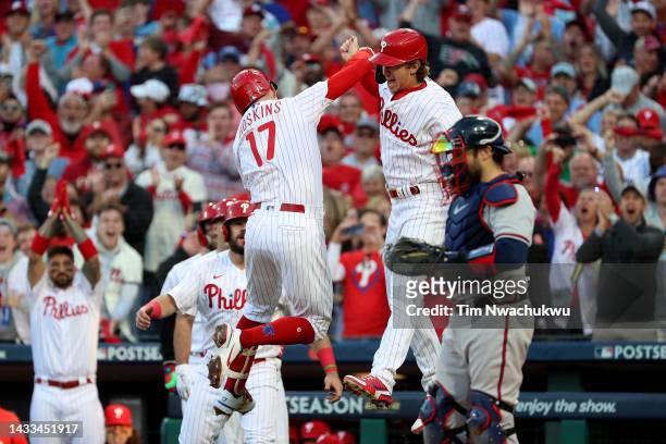 Rhys Hoskins of the Philadelphia Phillies celebrates with Bryson Stott after hitting a two run home run against Spencer Strider of the Atlanta Braves...