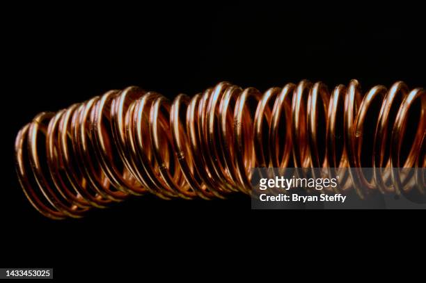 coils of copper - copper coil stock-fotos und bilder