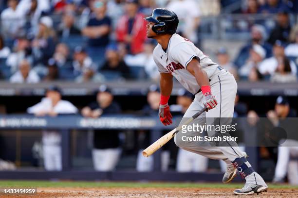 Oscar Gonzalez of the Cleveland Guardians hits a RBI single to score Jose Ramirez during the tenth inning against the New York Yankees in game two of...