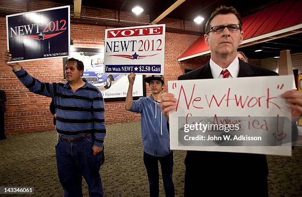 Supporters watch as Republican presidential candidate, former Speaker of the House Newt Gingrich speaks during a primary night gathering at the...