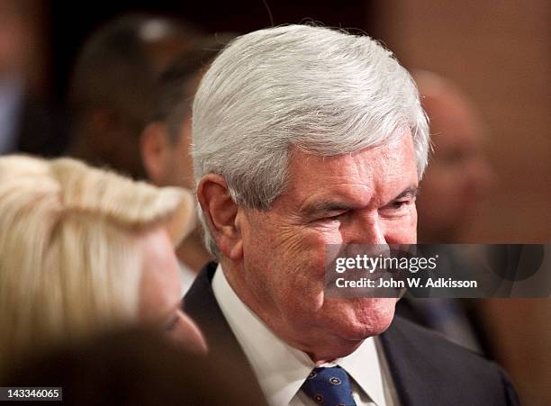 Republican presidential candidate, former Speaker of the House Newt Gingrich shakes hands with supporters after speaking during a primary night...