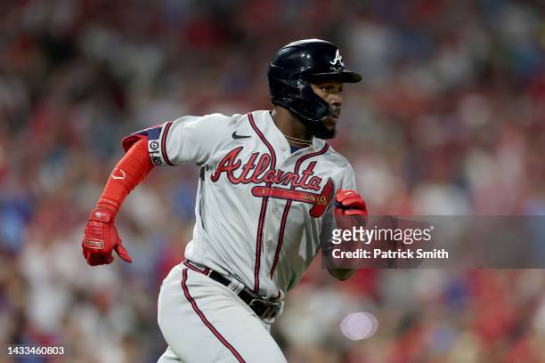 Michael Harris II of the Atlanta Braves runs to first base after hitting an RBI single against Aaron Nola of the Philadelphia Phillies during the...