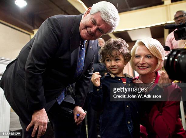 Republican presidential candidate, former Speaker of the House Newt Gingrich and his wife, Callista Gingrich, take a photo with Raphe Ploski , after...