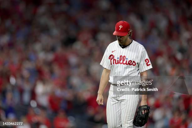 Aaron Nola of the Philadelphia Phillies walks back to the dugout after being relieved during the seventh inning against the Atlanta Braves in game...