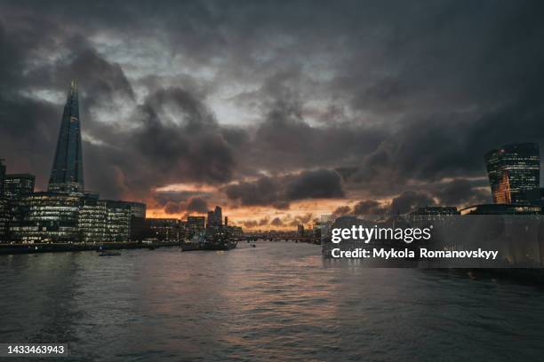 dramatic london sky, view from tower bridge. - london bridge stock pictures, royalty-free photos & images