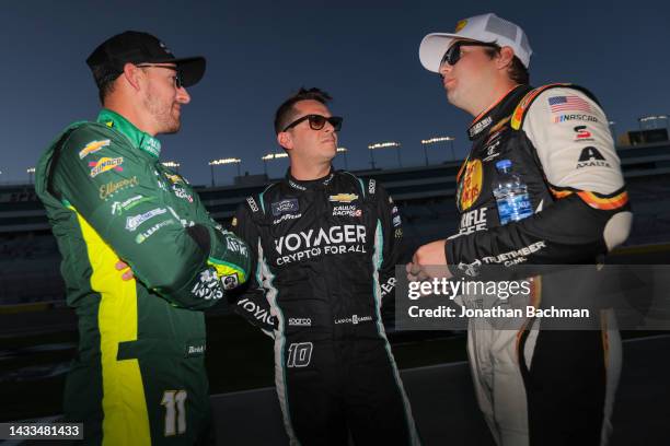 Daniel Hemric, driver of the Alsco Uniforms Chevrolet, Landon Cassill, driver of the Voyager: Crypto for All Chevrolet, and Noah Gragson, driver of...