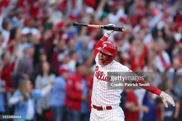 Rhys Hoskins of the Philadelphia Phillies celebrates by spiking his bat after hitting a three-run home run against Spencer Strider of the Atlanta...