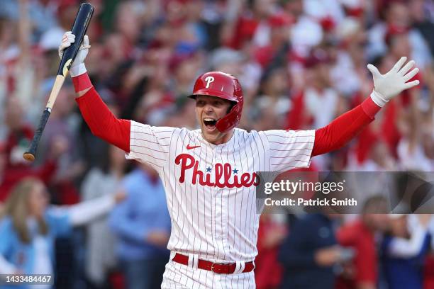 Rhys Hoskins of the Philadelphia Phillies celebrates by spiking his bat after hitting a three-run home run against Spencer Strider of the Atlanta...