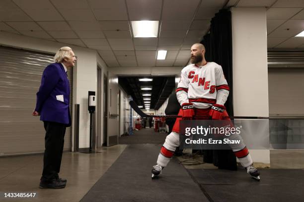 Brent Burns of the Carolina Hurricanes speaks with security guard Susan Shultz before their game against the San Jose Sharks at SAP Center on October...