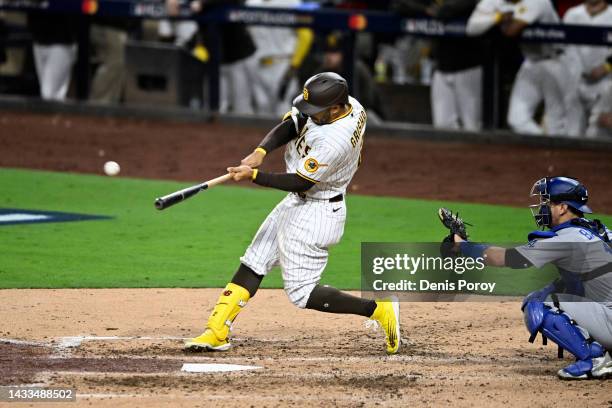 Trent Grisham of the San Diego Padres hits a home run against the Los Angeles Dodgers during the fourth inning in game three of the National League...