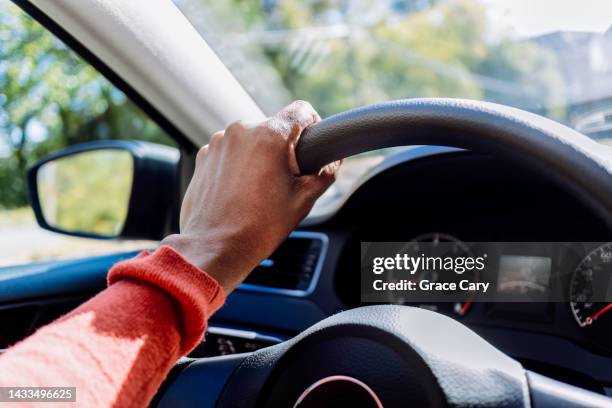 woman drives car - driver's seat stock pictures, royalty-free photos & images