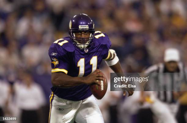 Quarterback Daunte Culpepper of the Minnesota Vikings runs with the ball against the Carolina Panthers during the game on September 22, 2002 at the...