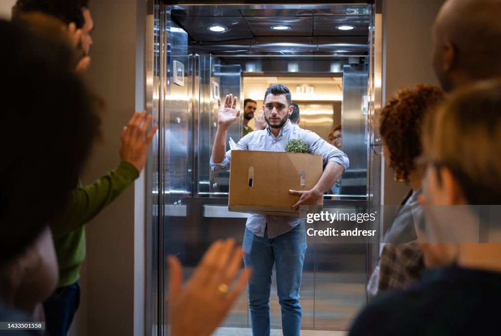 Man being fired at his job and leaving the office