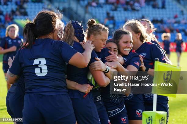Alev Kelter of the United States celebrates with teammates after scoring a try during the Pool B Rugby World Cup 2021 match between the United States...