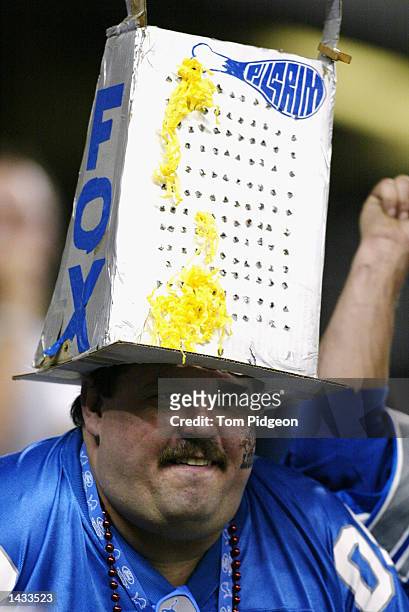 A Detroit Lions fan wears a cheese grater hat during the NFL game News  Photo - Getty Images