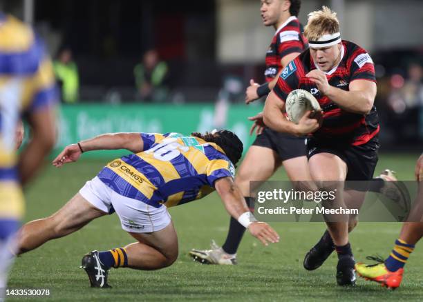 George Bell from Canterbury tries to avoid the tackle of Anaru Rangi from Bay of Plenty during the Bunnings NPC Semi Final match between Canterbury...