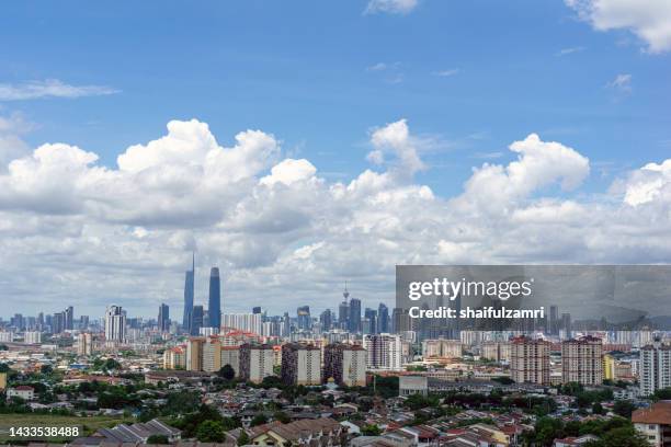 view of cumulus nimbus cloud over down town kuala lumpur, malaysia - menara kuala lumpur tower 個照片及圖片檔