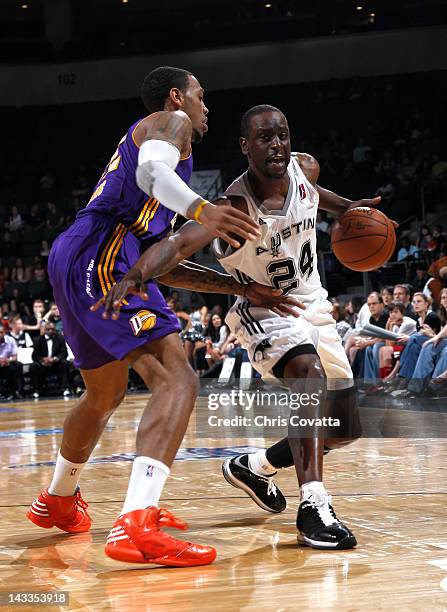 Flip Murray of the Austin Toros attempts to dribble past Malcolm Thomas of the Los Angeles D-Fenders in game one of the 2012 NBA Development League...