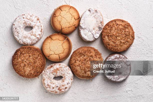 christmas shortbread, polvorones and sprinkled rosquillas. on white textured base - polvorón stock pictures, royalty-free photos & images