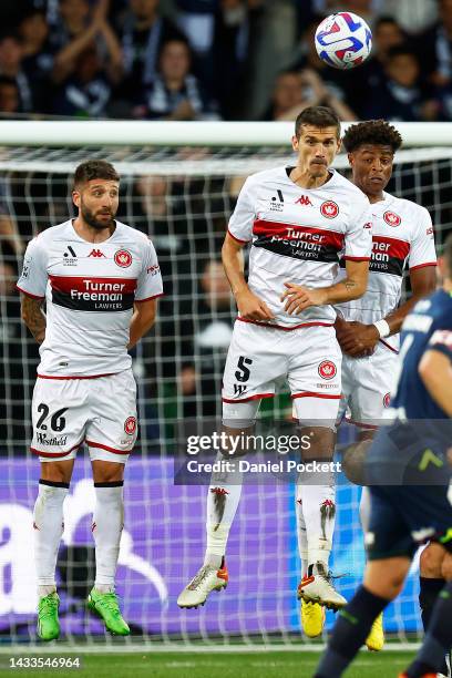 Brandon Borrello of the Wanderers, Tomislav Mrcela of the Wanderers and Kusini Yengi of the Wanderers defend a shot on goal during the round two...