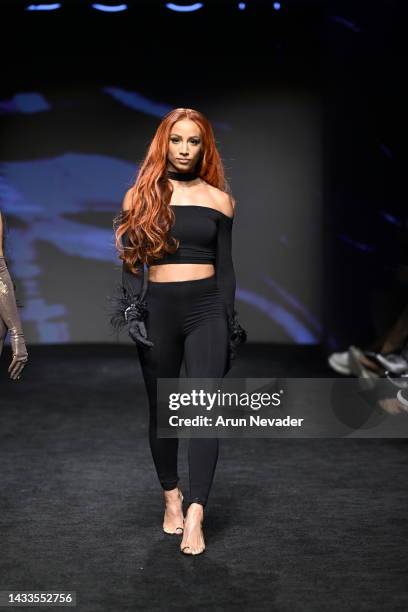 Sasha Banks walks the runway wearing Diva Fashion Couture at The Majestic Downtown on October 14, 2022 in Los Angeles, California.