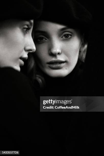 beautiful woman and her reflection - close up of beautiful young blonde woman with black hat stock pictures, royalty-free photos & images