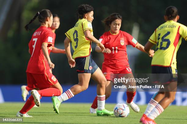 Yesica Munoz of Colombia and Licheng Wang and Yuexin Huo of China compete for the ball during the FIFA U-17 Women's World Cup 2022 Group C match...