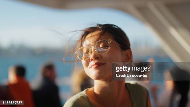 portrait of young female tourist traveling on ferry - beautiful woman candid face 個照片及圖片檔