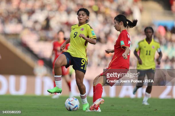 Yi Wang of China and Yesica Munoz of Colombia compete for the ball during the FIFA U-17 Women's World Cup 2022 Group C match between China and...