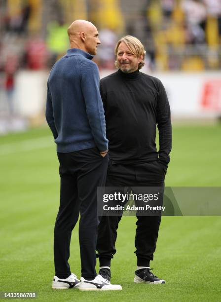 Thomas Letsch, Head Coach of VfL Bochum interacts with Sven Mislintat, Sporting Director of VfB Stuttgart prior to the Bundesliga match between VfB...