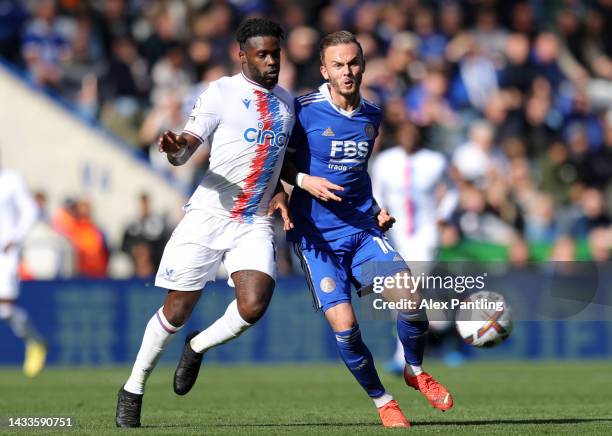 James Maddison of Leicester City is challenged by Jeffrey Schlupp of Crystal Palace during the Premier League match between Leicester City and...