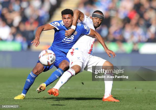 Jordan Ayew of Crystal Palace battles for possession with James Justin of Leicester City during the Premier League match between Leicester City and...