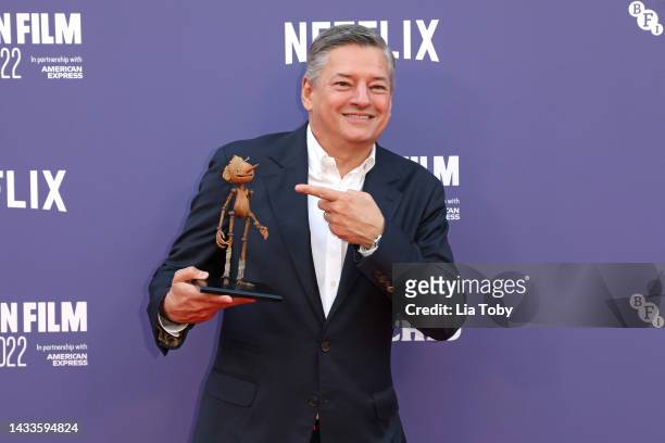 Chief Content Officer of Netflix, Ted Sarandos poses with a small replica of Pinocchio during the "Guillermo Del Toro's Pinocchio" world premiere...