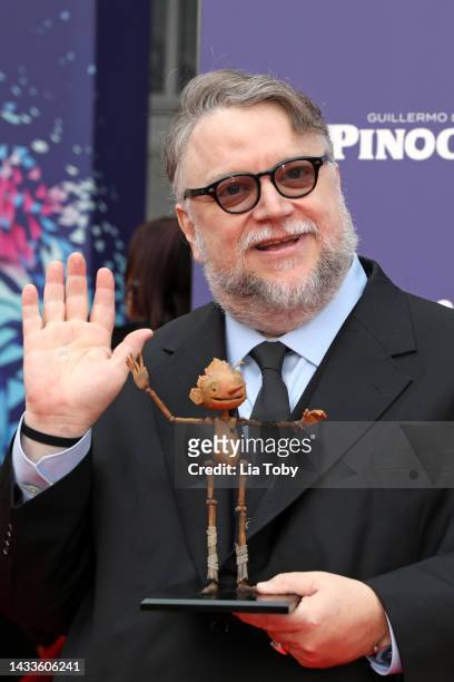 Director Guillermo del Toro poses with a small replica of Pinocchio during the "Guillermo Del Toro's Pinocchio" world premiere during the 66th BFI...