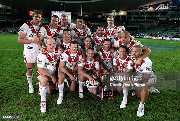 The Dragons celebrate with the Anzac Cup after the round eight NRL match between the St George Illawarra Dragons and the Sydney Roosters at Allianz...