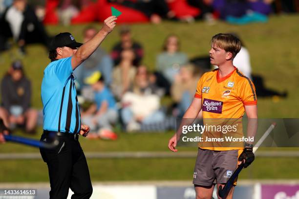 Luca Brown of the Brisbane Blaze receives a green card from the referee during the round three Hockey One Men's League match between Perth...