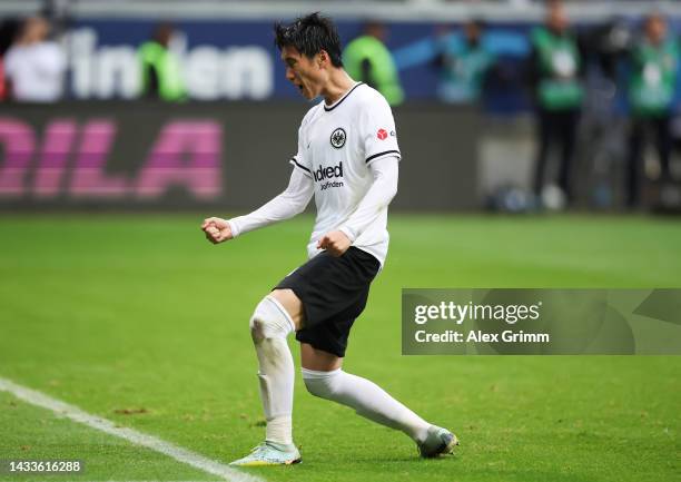 Daichi Kamada of Eintracht Frankfurt celebrates after scoring their team's first goal from the penalty spot during the Bundesliga match between...