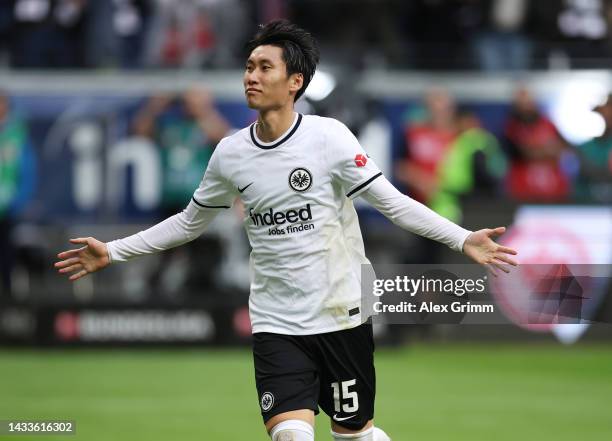 Daichi Kamada of Eintracht Frankfurt celebrates after scoring their team's first goal from the penalty spot during the Bundesliga match between...