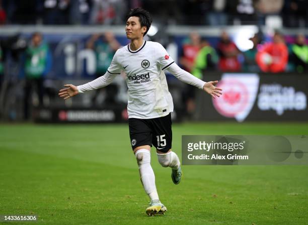 Daichi Kamada of Eintracht Frankfurt celebrates after scoring their team's first goal from the penalty spot during the Bundesliga match between...