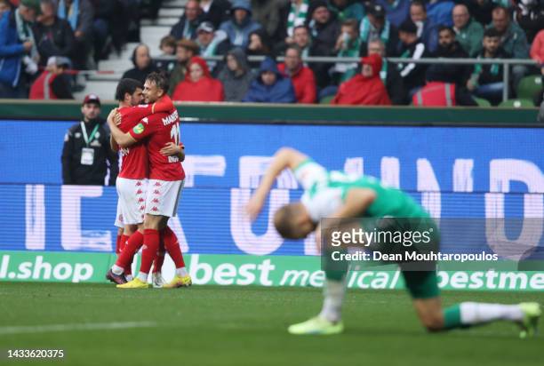 Lee Jae-Song of 1.FSV Mainz 05 celebrates with teammates after scoring their team's second goal during the Bundesliga match between SV Werder Bremen...