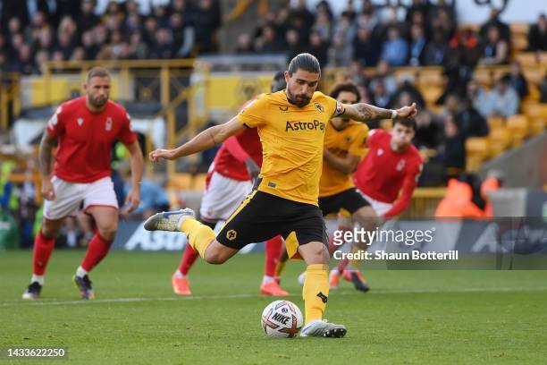 Ruben Neves of Wolverhampton Wanderers scores their team's first goal from the penalty spot during the Premier League match between Wolverhampton...