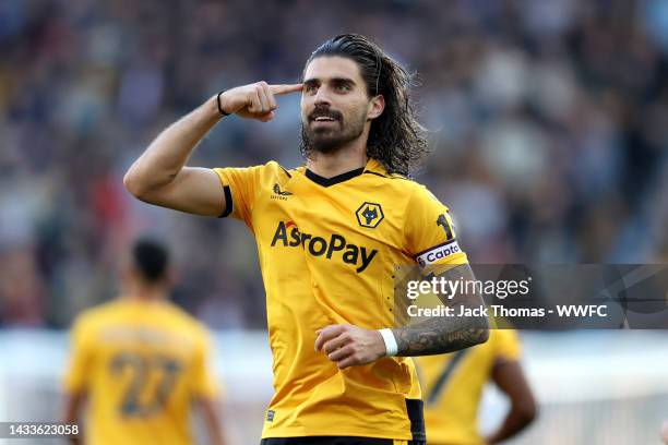 Ruben Neves of Wolverhampton Wanderers celebrates after scoring their team's first goal from the penalty spot during the Premier League match between...