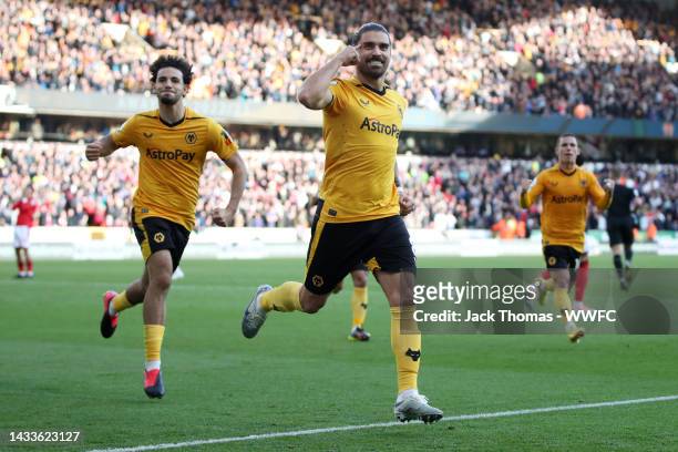 Ruben Neves of Wolverhampton Wanderers celebrates after scoring their team's first goal from the penalty spot during the Premier League match between...