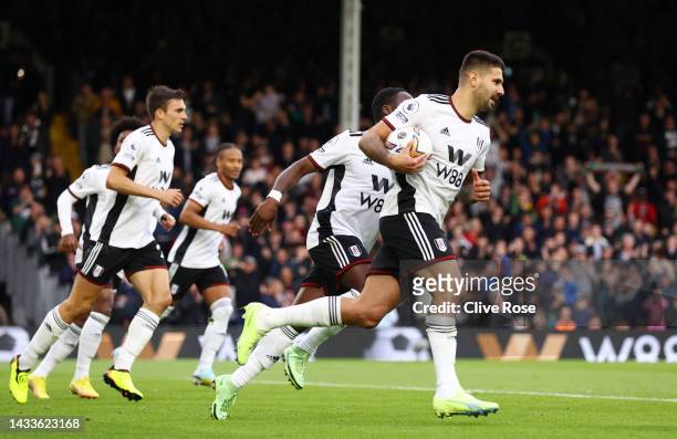 Aleksandar Mitrovic of Fulham celebrates after scoring their team's second goal from the penalty spot during the Premier League match between Fulham...