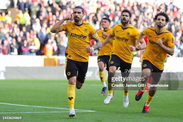 Ruben Neves of Wolverhampton Wanderers celebrates after scoring his sides first goal from the penalty spot during the Premier League match between...