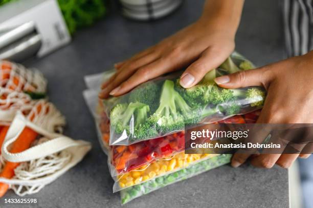 fresh ripe vegetables in plastic bags - rotting garbage stock pictures, royalty-free photos & images