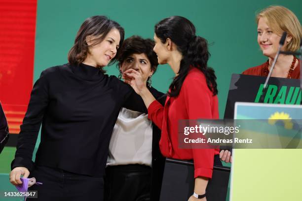 German Foreign Minister and leading Greens party member Annalena Baerbock comforts Pegah Ferydoni after her speech to the federal deligates during...