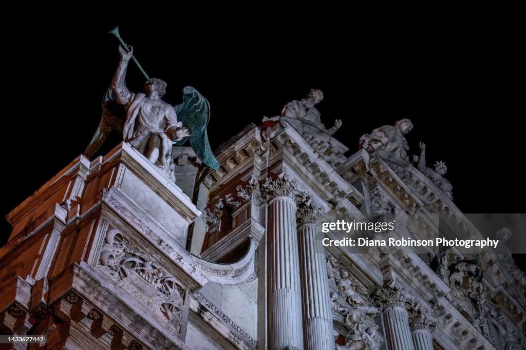 The angel Gabriel on the outside of the Chiesa di Santa Maria del Giglio in Campo Santa Maria Zobenigo at night, Venice, Italy