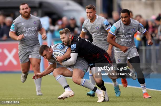 Matt Gallagher of Bath is tackled by Elliot Daly of Saracens during the Gallagher Premiership Rugby match between Saracens and Bath Rugby at StoneX...