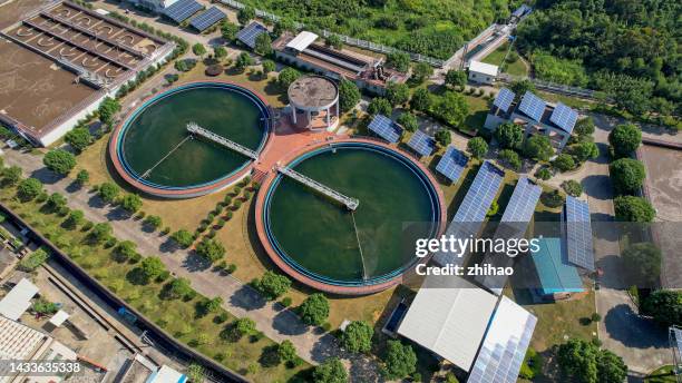 aerial view of sewage treatment plant with solar panels - 浄水 ストックフォトと画像